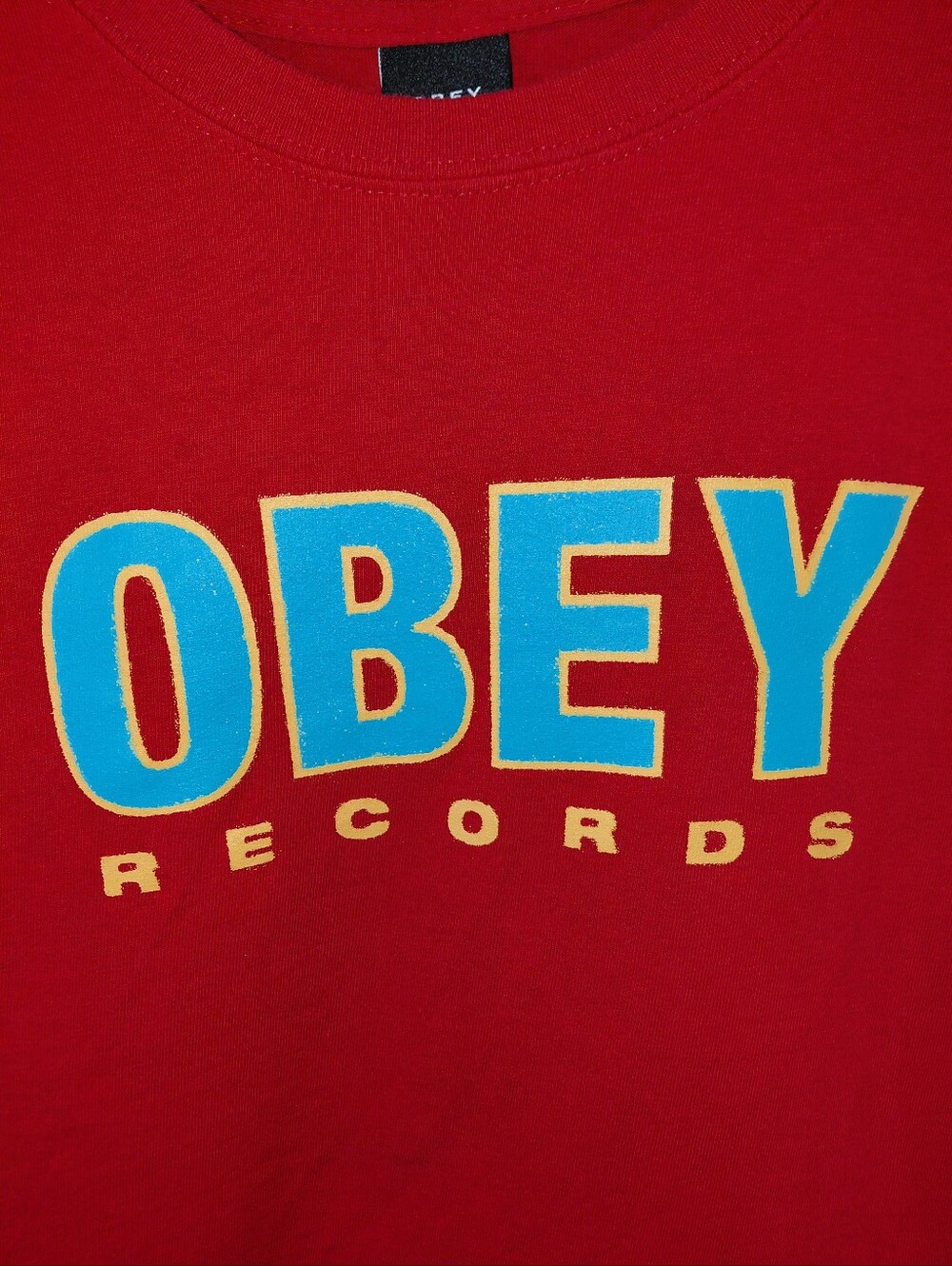 Obey Red Tee with Blue and Yellow Logo